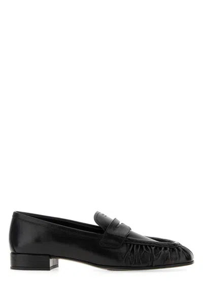 Prada Rounded Toe Loafers With Textured Detailing And Low Block Heel In Black