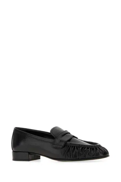 Prada Rounded Toe Loafers With Textured Detailing And Low Block Heel In Black