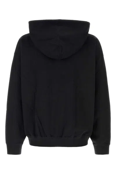 Y-3 Relaxed-fit Black Hoodie With Subtle Front Logo And Side Pockets In Black