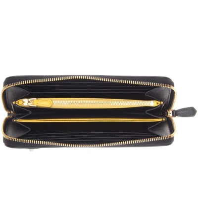 Shop Prada Saffiano Leather Zip-around Wallet In Eero