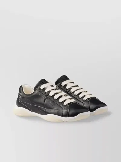 Prada Handcrafted Leather Sneakers Geometric Stitching In Black