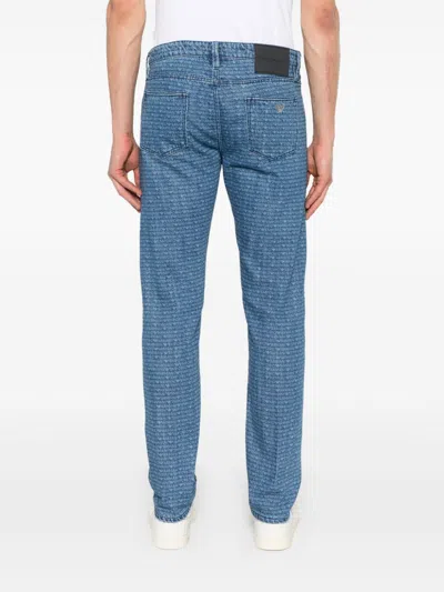 Emporio Armani Allover Logo Denim Jeans In Black