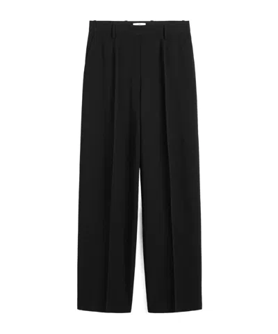 Totême Pleated Wool Wide-leg Trousers In Black