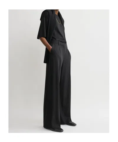 Totême Pleated Wool Wide-leg Trousers In Black