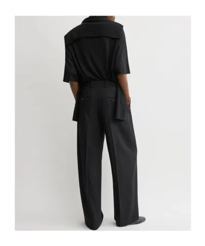 Totême Pleated Wool Wide-leg Trousers In Black