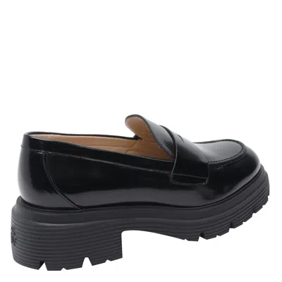 Stuart Weitzman Round Toe Chunky Sole Glossy Loafers In Black