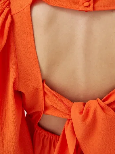 Notes Du Nord Puff-sleeve Tie-back Top In Orange