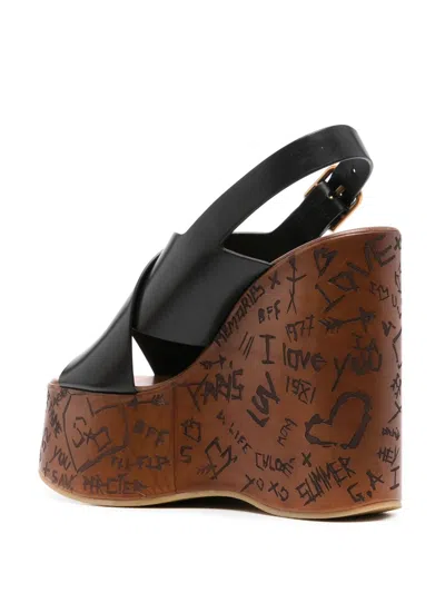 Chloé Women 'maxime' Black Wedges With High Embossed High Wedge Heel And Crossover Strap On The Toe In Black