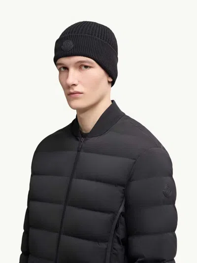 Moncler Textured Knit Hat With Prominent Logo Detail In Black