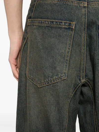 旋褶拉链口袋牛仔裤