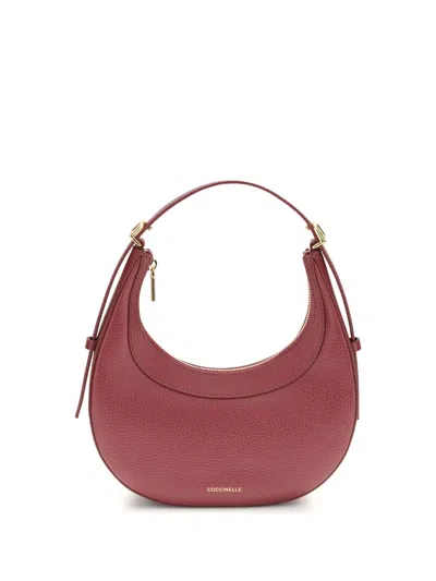 Coccinelle Whisper Crescent Top-handle Shoulder Bag In Red