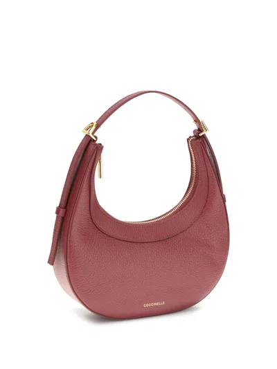 Coccinelle Whisper Crescent Top-handle Shoulder Bag In Red