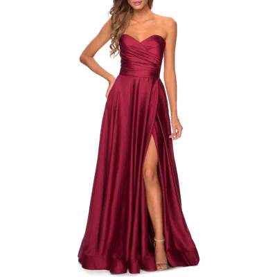 La Femme Strapless Satin Gown With Pleated Bodice And Slit In Burgundy