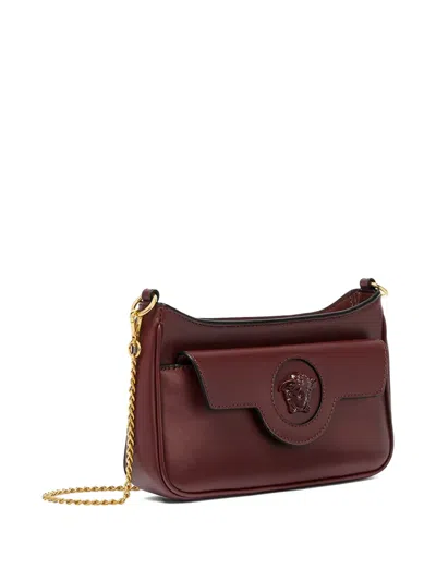 Versace Small La Medusa Leather Shoulder Bag In Burgundy