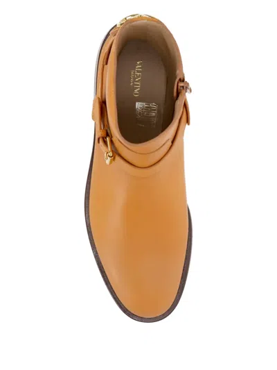 Valentino Buckle-strap Leather Boots In Brown