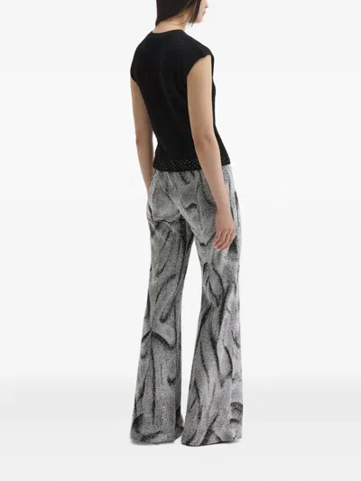 Maccapani Easy Swirl-print Flared Trousers In Black