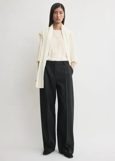 Totême Pleated Wool Wide-leg Trousers In Black