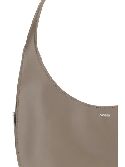 Coperni Medium Curved Shoulder Bag With Top Handle In Brown
