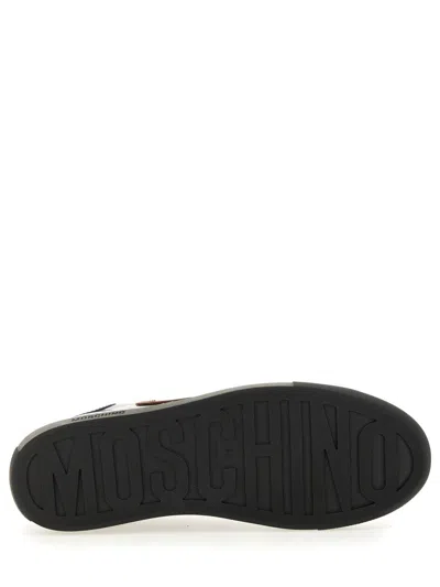 Moschino Round Toe Sneakers With Flat Sole And Stitching In Black