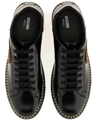 Moschino Round Toe Sneakers With Flat Sole And Stitching In Black