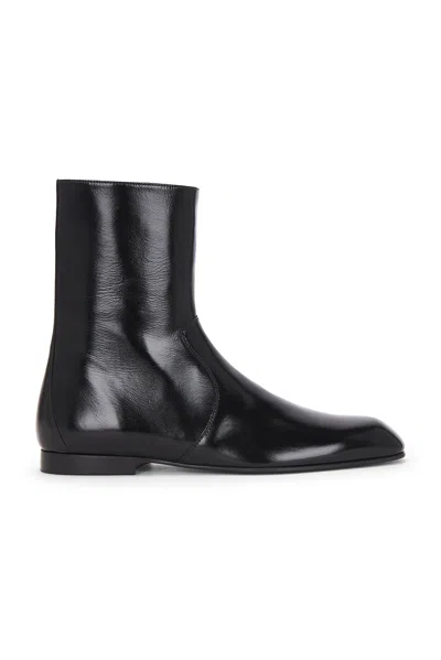 Khaite Glossy Enameled Leather Boot In Black