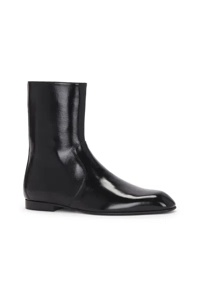 Khaite Glossy Enameled Leather Boot In Black