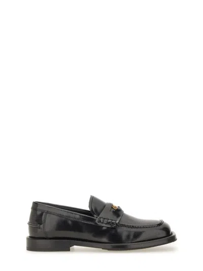 Moschino Brushed Calfskin Loafers In Black