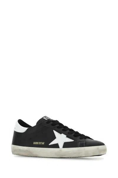 Golden Goose 'super-star' Black Low Top Sneakers With Logo Patch And Suede Details In Leather Man In Black