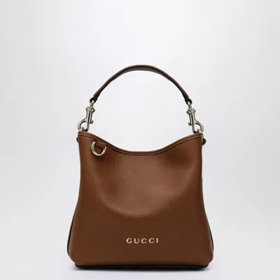 Gucci Mini Gg Embossed Leather Bucket Bag In Brown