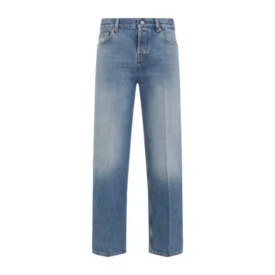 Gucci Blue Jeans With Logo Patch On The Rear And Faded Effect In Denim Woman