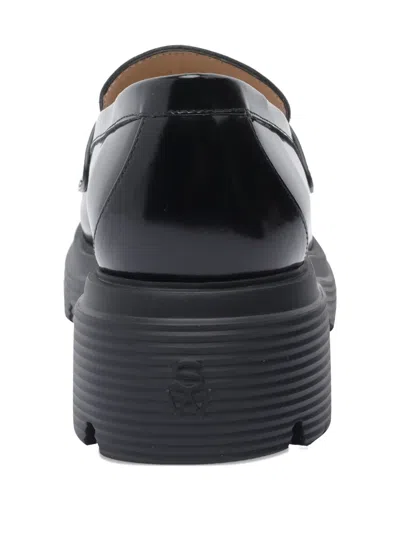 Stuart Weitzman Round Toe Chunky Sole Glossy Loafers In Black