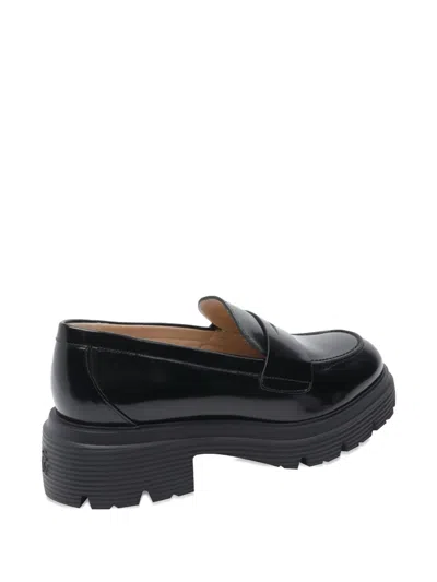 Stuart Weitzman Round Toe Chunky Sole Glossy Loafers In Black
