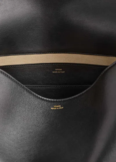 Totême T-lock Foldover Top Shoulder Bag In Black
