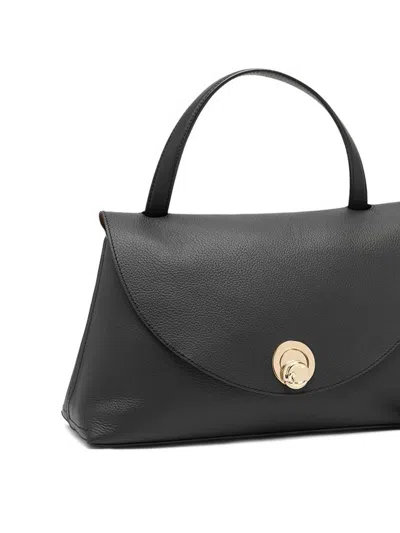 Coccinelle Black Foldover Top Handbag With Clasp Fastening And Zip Pocket In Black