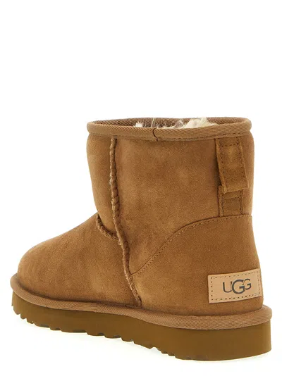Ugg 10mm Mini Classic Ii Shearling Boots In Brown