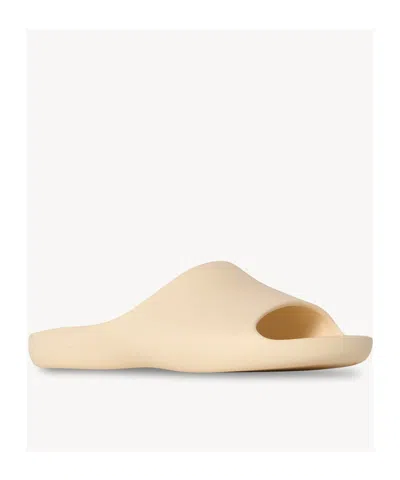 The Row Ama Rubber Slide Sandals In Brown