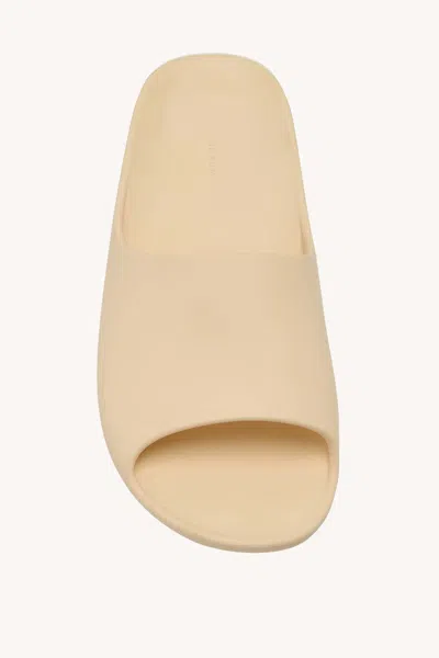 The Row Ama Rubber Slide Sandals In Brown