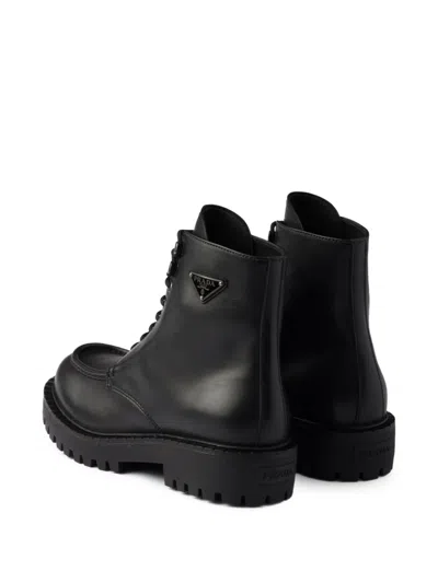 Prada Laced Leather Booties In Black