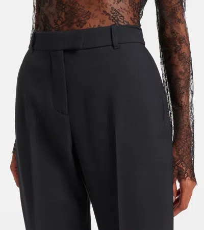 Alexander Mcqueen Tailored Wool Trousers Featuring Flared Hem In Black