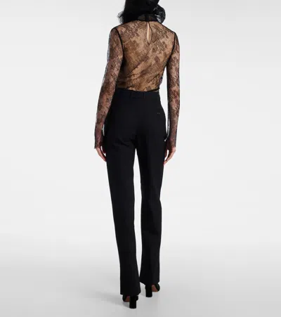 Alexander Mcqueen Tailored Wool Trousers Featuring Flared Hem In Black