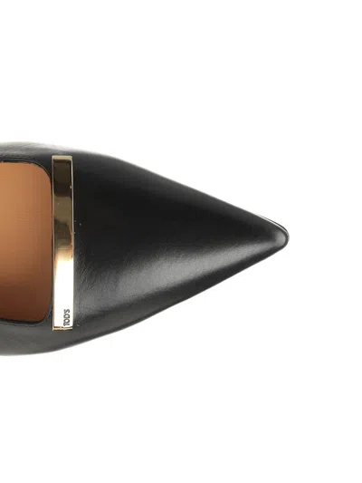 Tod's Leather Flat Ballerinas With Gold-tone Detail In Black