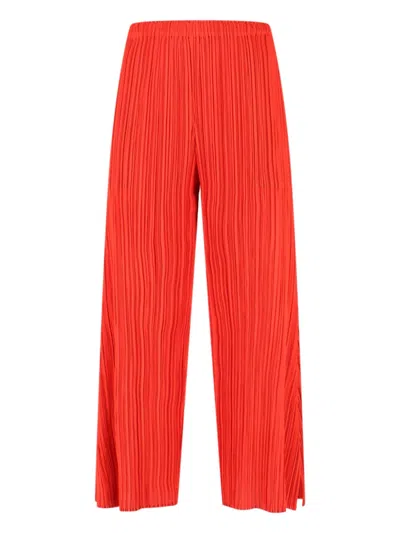 Pleats Please Wide-leg Cropped Trousers With Distinctive Pleated Texture In Red