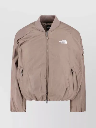 The North Face Beige Padded Bomber Jacket With Shawl Collar And Ribbed Trimming In Nude