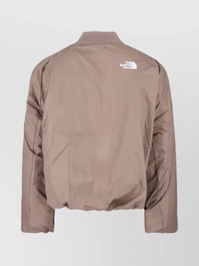 The North Face Beige Padded Bomber Jacket With Shawl Collar And Ribbed Trimming In Nude