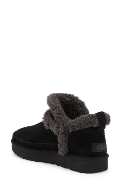 Ugg(r) Classic Ultra Mini Spillseam Genuine Shearling Bootie In Black
