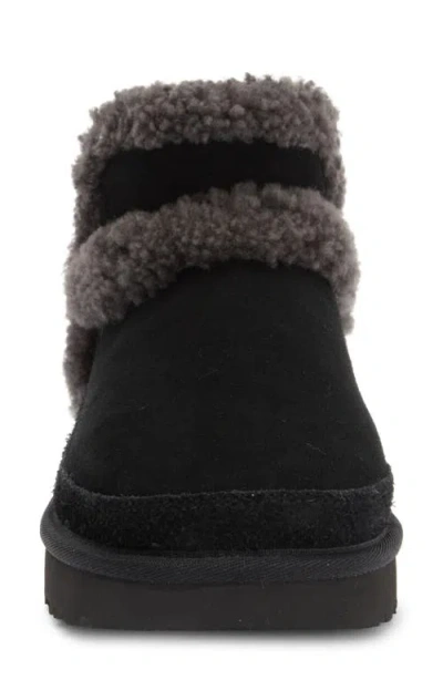 Ugg(r) Classic Ultra Mini Spillseam Genuine Shearling Bootie In Black