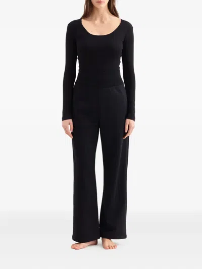 Eres Twist-back Long-sleeved Top In Black