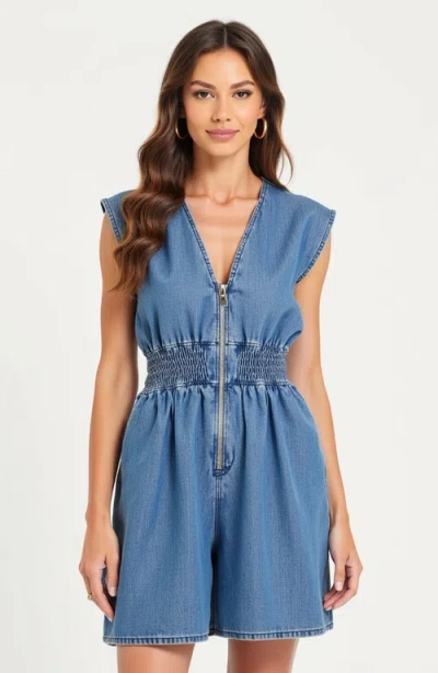 Modenaire Denim Romper With Cap Sleeves Smocked Waist And Front Zip Closure In Blue