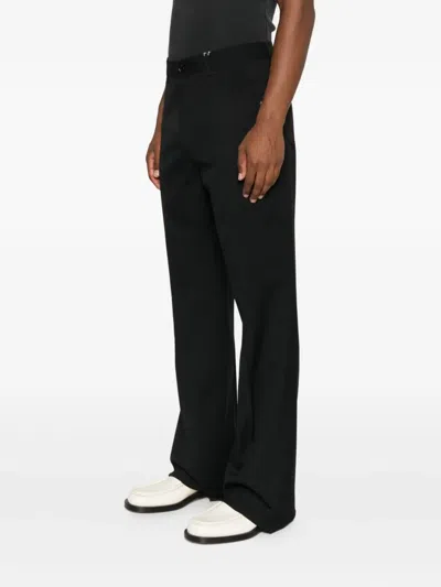 Amiri Button-fly Bootcut Trousers In Black