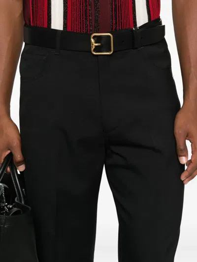 Amiri Button-fly Bootcut Trousers In Black